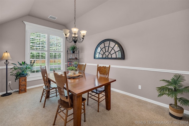 carpeted dining space featuring lofted ceiling and a notable chandelier