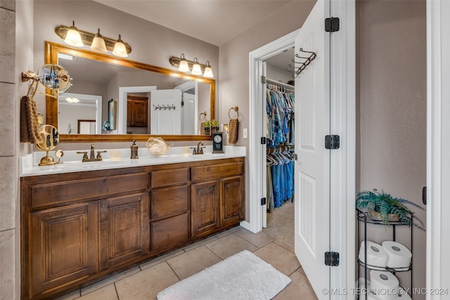 bathroom with tile patterned flooring and vanity