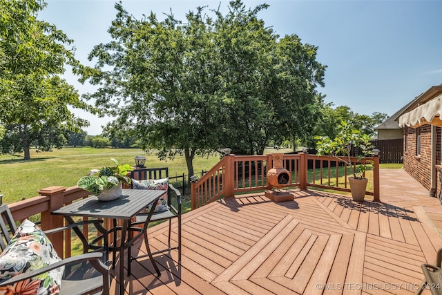 deck featuring a yard