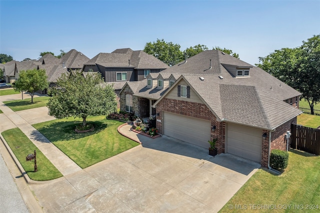 view of front of home featuring a front yard and a garage