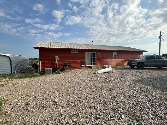 back of property with central air condition unit