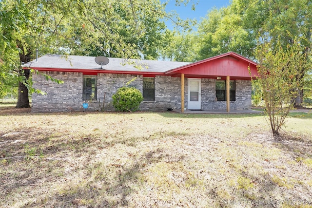 ranch-style house with a front lawn