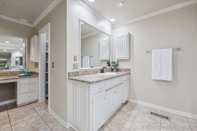 bathroom featuring vanity, ornamental molding, and tile patterned floors