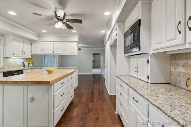 kitchen with black appliances, white cabinets, ornamental molding, and wood counters