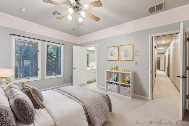 empty room featuring baseboards, carpet floors, a tray ceiling, ceiling fan, and crown molding