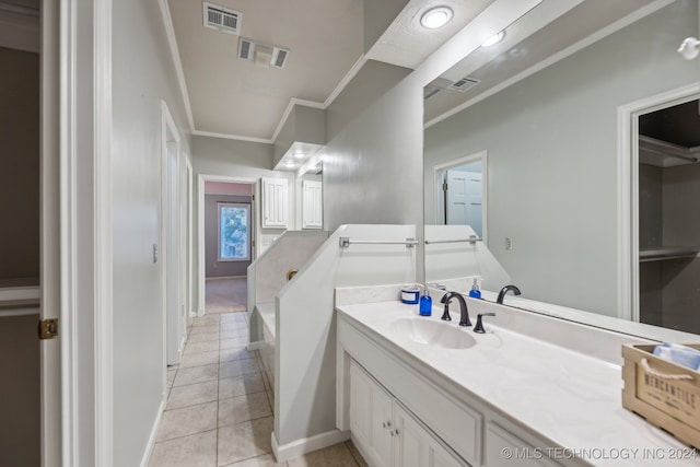 bathroom featuring tile patterned floors, visible vents, vanity, and ornamental molding