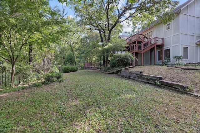 view of yard with a wooden deck