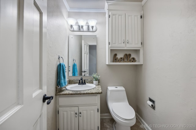 bathroom featuring crown molding, vanity, and toilet