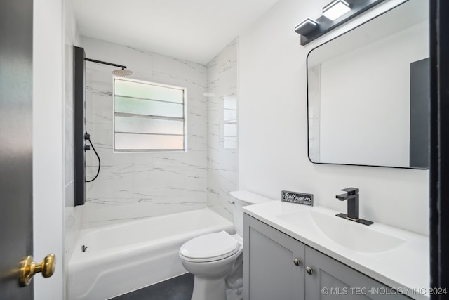 full bathroom with tiled shower / bath combo, vanity, and toilet