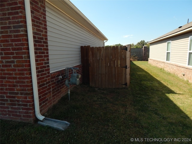 view of home's exterior featuring a yard