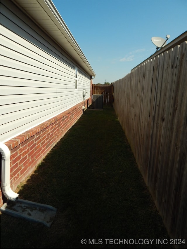 view of yard with central AC