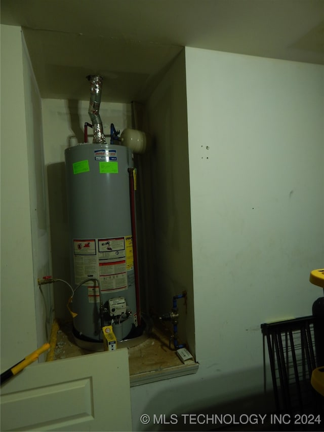 utility room featuring gas water heater