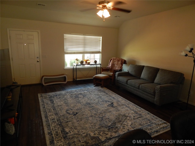 living room with ceiling fan, lofted ceiling, and dark hardwood / wood-style floors