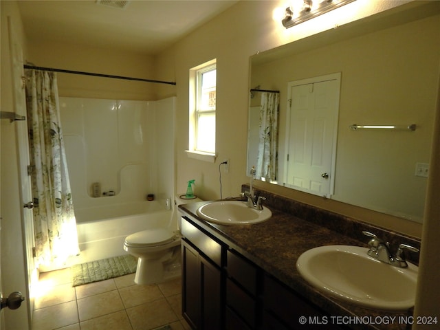 full bathroom featuring tile patterned flooring, vanity, toilet, and shower / bathtub combination with curtain