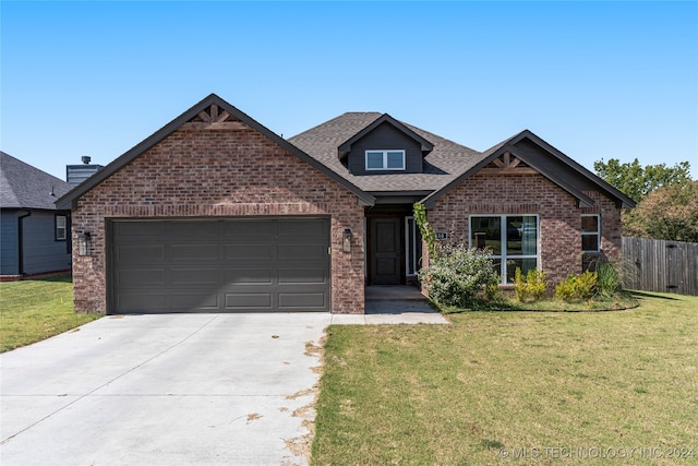 craftsman-style home with a front lawn and a garage