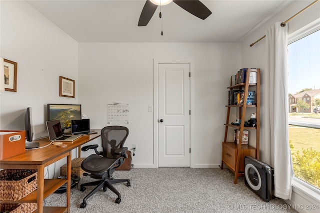 home office with ceiling fan and light colored carpet