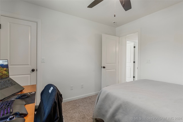 bedroom with ceiling fan and carpet floors