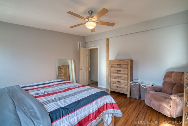 bedroom featuring dark hardwood / wood-style floors and ceiling fan