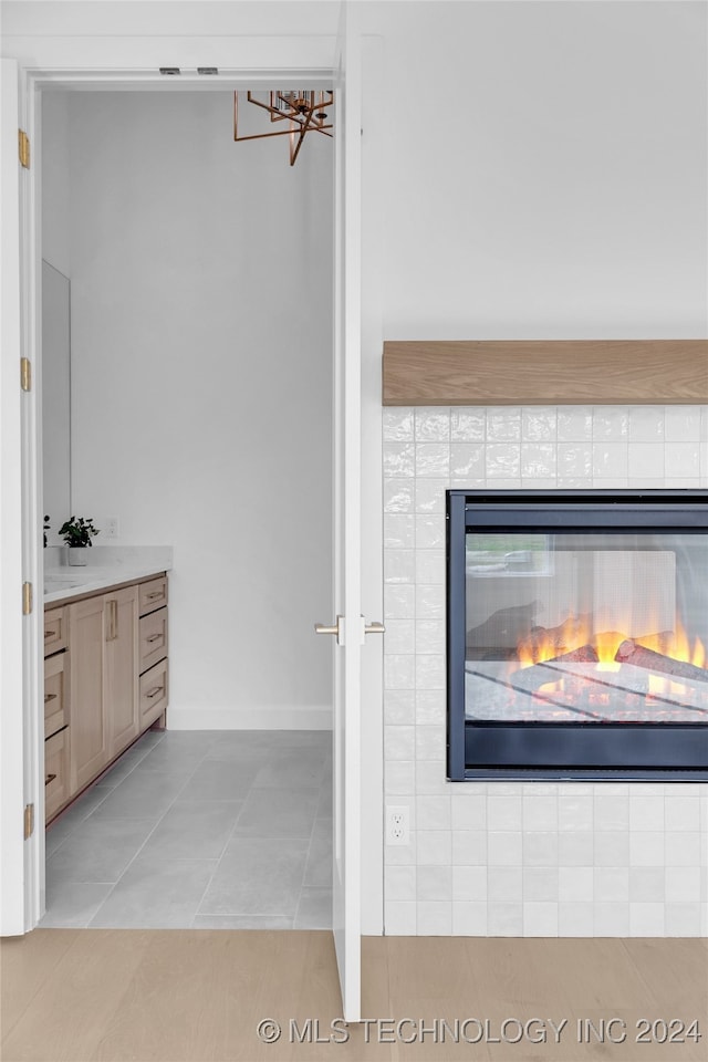 room details with a fireplace and tile patterned floors