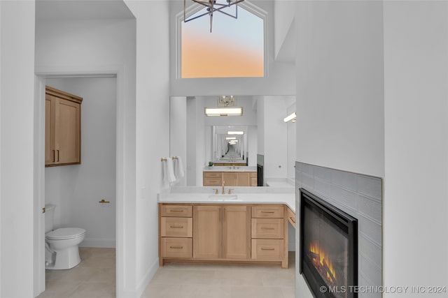 bathroom with vanity, toilet, and tile patterned floors