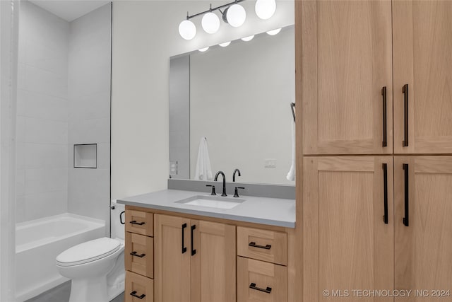 full bathroom with vanity, toilet, and  shower combination