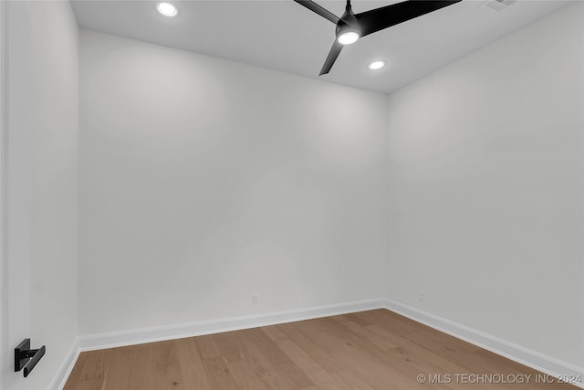 empty room featuring wood-type flooring and ceiling fan