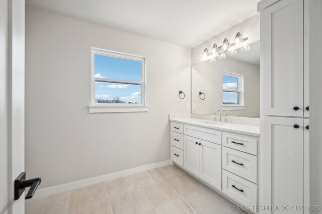17599 S Harvard Ave, Mounds, OK 74047 - bathroom featuring vanity and baseboards