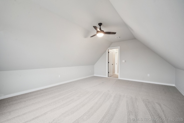 additional living space with ceiling fan, lofted ceiling, and carpet floors