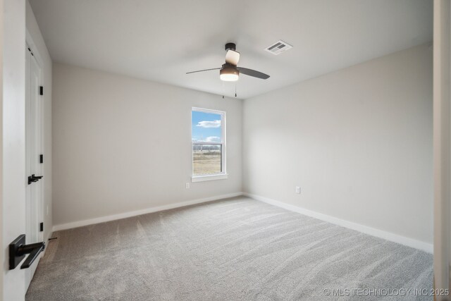 17599 S Harvard Ave, Mounds, OK 74047 - spare room with carpet floors, a ceiling fan, and baseboards