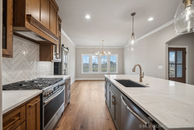 kitchen with sink, stainless steel appliances, ornamental molding, light hardwood / wood-style floors, and light stone countertops