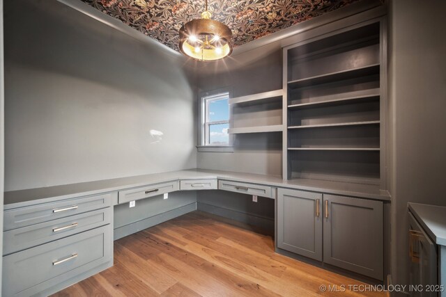 17599 S Harvard Ave, Mounds, OK 74047 - unfurnished office with built in desk, light wood finished floors, and an ornate ceiling