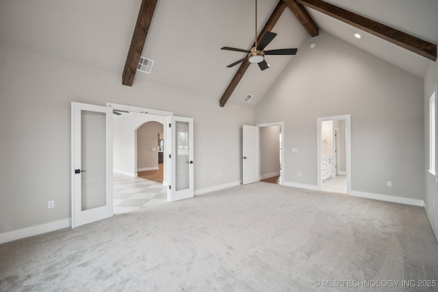 interior space featuring ceiling fan, beam ceiling, high vaulted ceiling, light colored carpet, and french doors