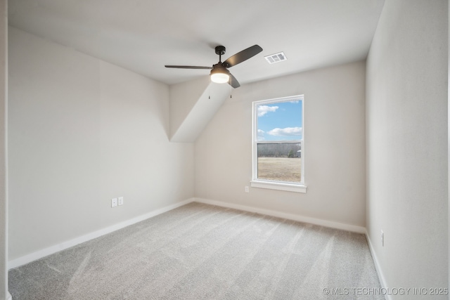 additional living space with carpet flooring and ceiling fan