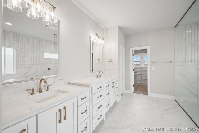 17599 S Harvard Ave, Mounds, OK 74047 - full bathroom featuring marble look tiles, a marble finish shower, double vanity, and baseboards