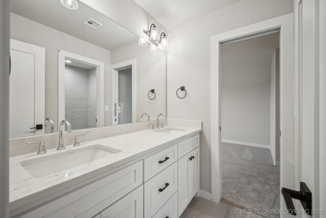 17599 S Harvard Ave, Mounds, OK 74047 - full bath featuring double vanity and baseboards