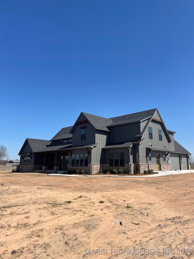 back of house featuring board and batten siding