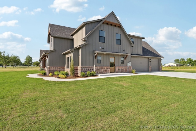 17599 S Harvard Ave, Mounds, OK 74047 - view of front of home featuring board and batten siding, concrete driveway, a front yard, and roof with shingles