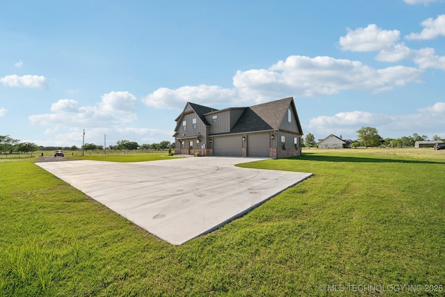 17599 S Harvard Ave, Mounds, OK 74047 - view of property exterior featuring driveway, board and batten siding, a lawn, and an attached garage