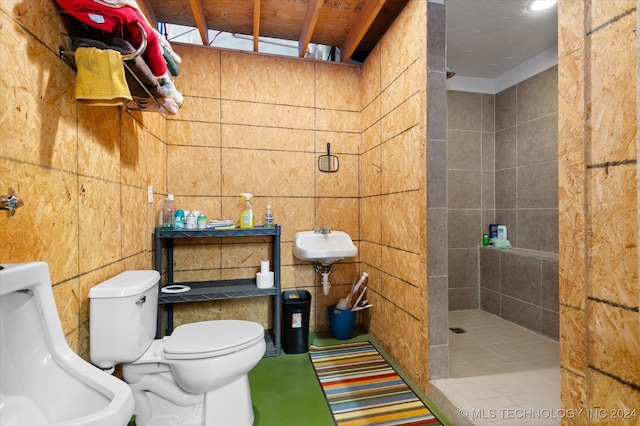 bathroom featuring walk in shower, tile walls, and toilet