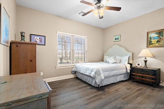 bedroom featuring ceiling fan and dark hardwood / wood-style floors