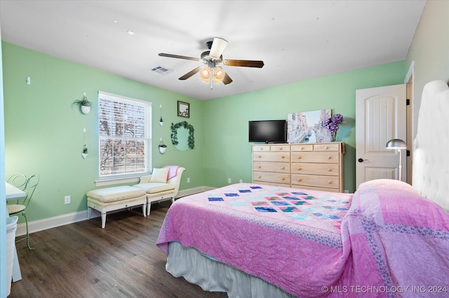 bedroom with dark wood-type flooring and ceiling fan