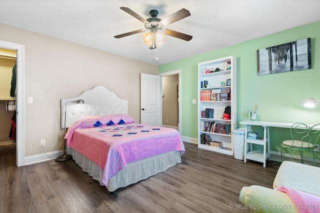 bedroom featuring ceiling fan and dark hardwood / wood-style floors