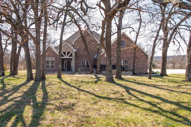 tudor house with a front yard