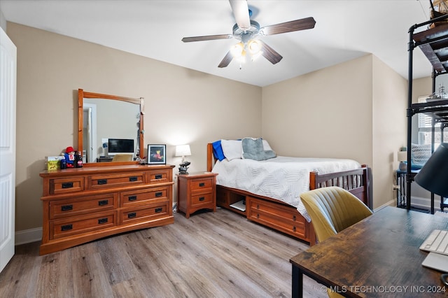 bedroom with ceiling fan and light hardwood / wood-style flooring