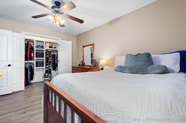 bedroom with ceiling fan and hardwood / wood-style floors