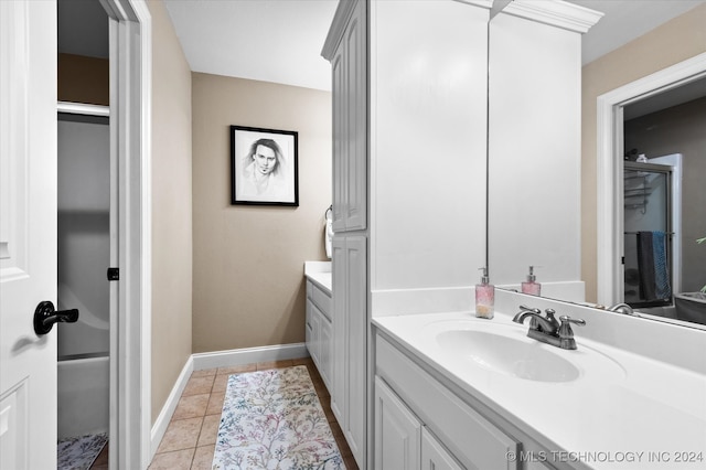 bathroom with tile patterned flooring and vanity