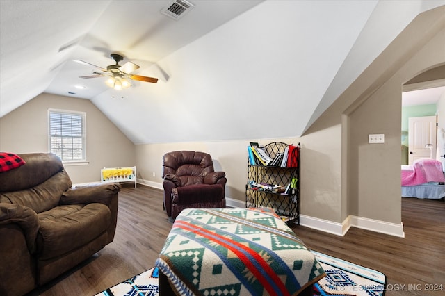 living room with vaulted ceiling, ceiling fan, and dark hardwood / wood-style flooring