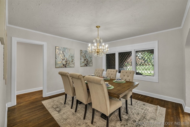 dining area with an inviting chandelier, crown molding, a textured ceiling, and dark hardwood / wood-style floors