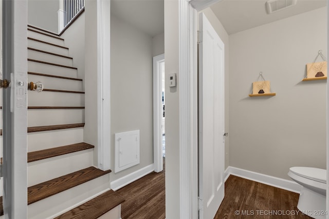 staircase featuring hardwood / wood-style flooring