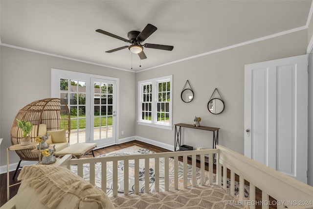 bedroom featuring ceiling fan, hardwood / wood-style flooring, and crown molding